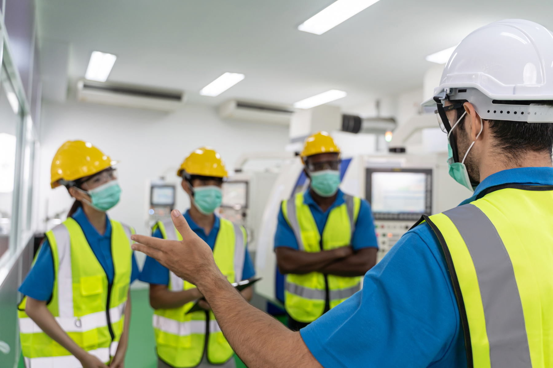 People Working in Construction with Masks